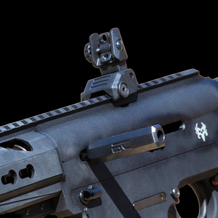 Extended machined charging handle for Berika 12g competition shotguns, oversized racking surface