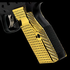 Pair of CZ Shadow 2 solid brass grip panels laid flat, showing gold and black plating