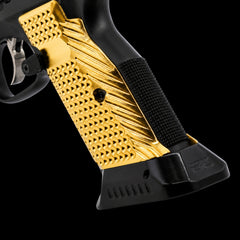 CZ Shadow 2 brass magwell and flat grips shown together, gold and black plated finishes