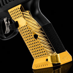 Angled view of the CZ Shadow 2 brass magwell and palm swell grips bundle components