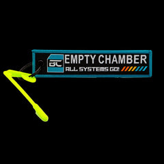 High-visibility centrefire chamber safety flag, empty chamber indicator — angled view