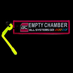 High-visibility centrefire chamber safety flag, empty chamber indicator — side profile view